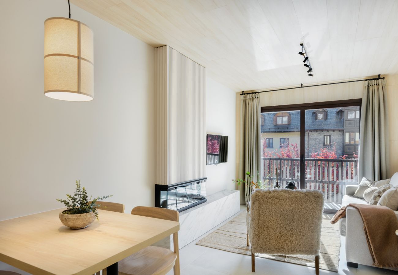 Bright living room with access to a balcony and views of the ski resort in Panticosa