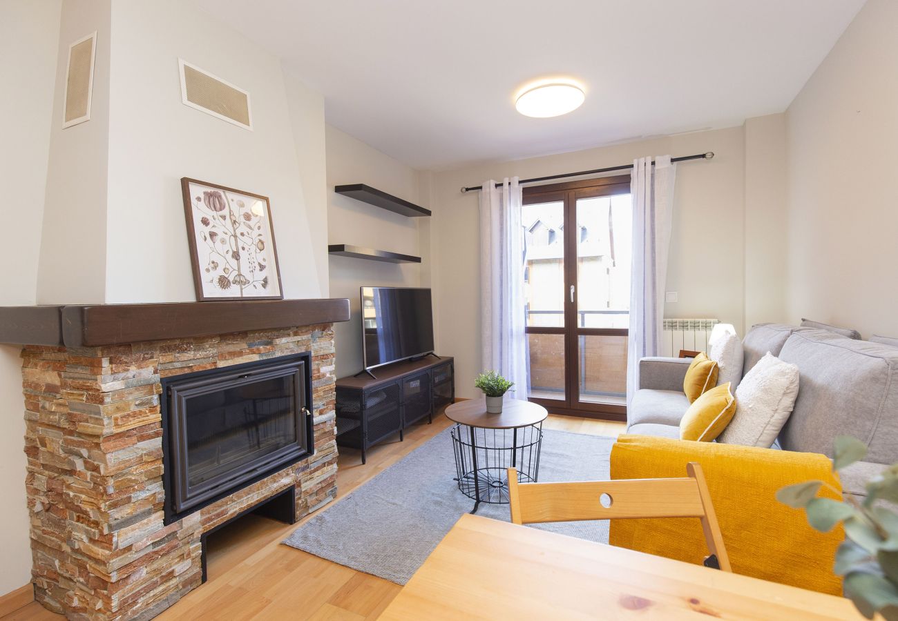 Living room in the Pyrenees with natural light and warm design in Panticosa.
