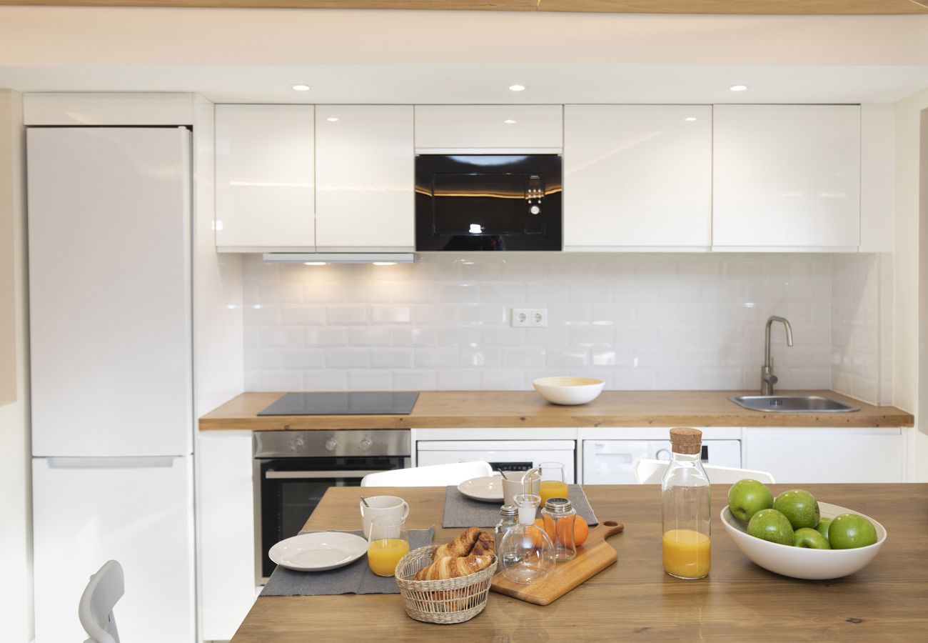 Open-design equipped kitchen designed to enjoy comfort and the essence of the Pyrenees in El Pueyo de Jaca.