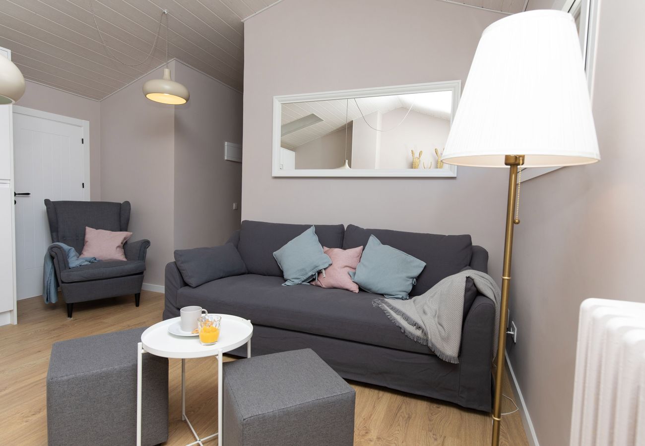 Modern living-dining room with an open kitchen and a comfortable atmosphere in Sallent.